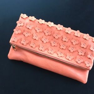 Clutch bag. Flower embellishments.